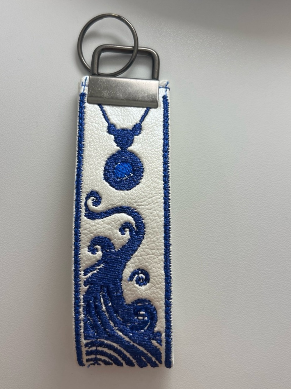 ATLA Katara-Inspired Wristlet with Blue Necklace Embroidered Wave Design